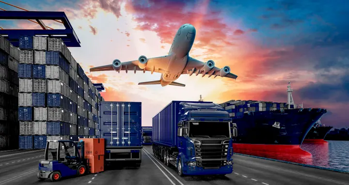 Cargo plane, ship and trucks at a port