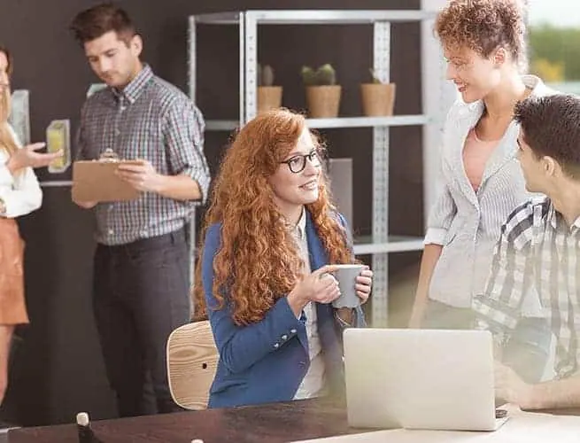 Colleagues talking in an office